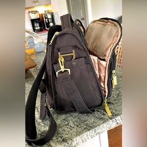 Jujube bag with changing pad and shoulder strap. Use as backpack/ shoulder bag.